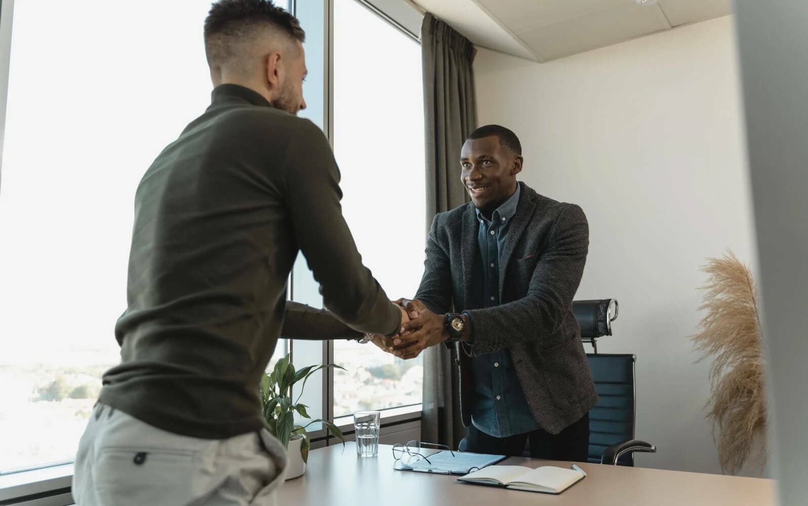 Two persons shaking hand Knock out recruiting