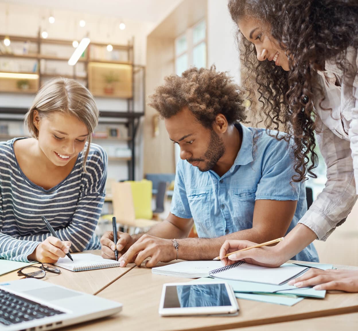 Three people working together