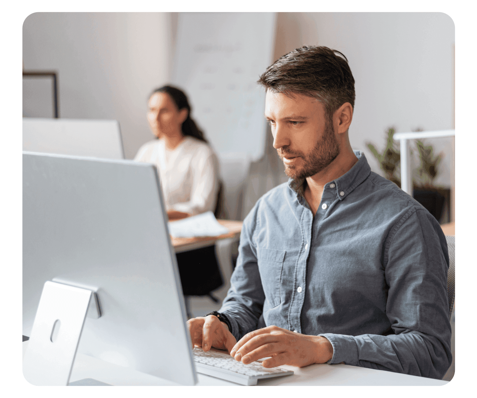 A man working in front of a computer