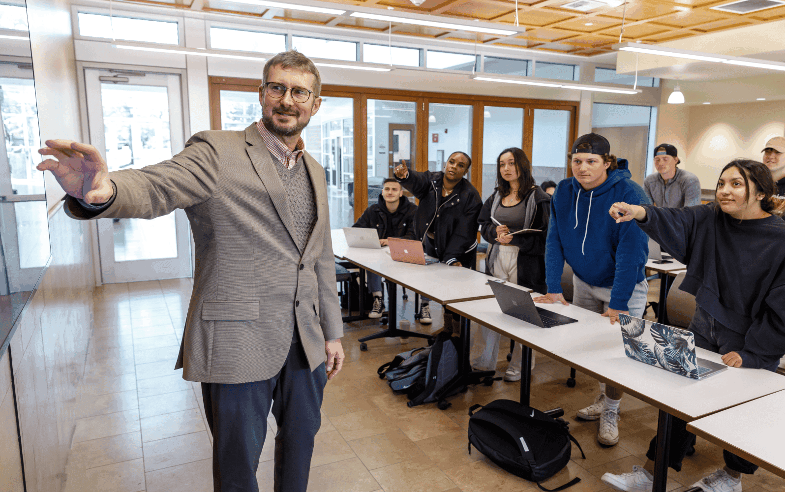 A professor with students having a discussion A professor with students having a discussion