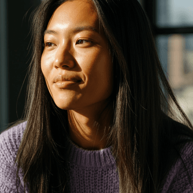 EF logo over an image of a person looking sideways and smiling